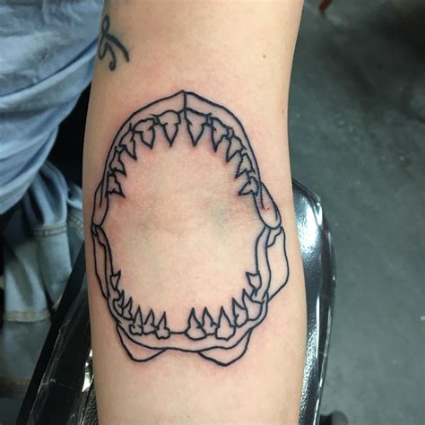 Unleash your fierce side with a Shark Jaw Elbow Tattoo
